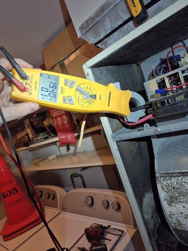 Responded to no heat call where customer reported electric bill 4x higher and fan motor continuously running. Diagnostic testing revealed system unable to reach set temperature (55°F reading with 53°F actual) with maximum heat output of 63°F. Conducted electrical testing with Fieldpiece meter showing 140.7V reading at component connection. Inspected PVC venting system and electrical connections. Resolved continuous fan operation issue and corrected heating performance problem. Customer was informed of completed repairs.