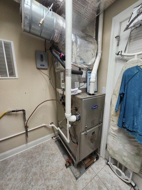 Successfully completed installation of a complete Carrier HVAC system, including a 59SC2E040M17 92% Gas Furnace with ECM Blower, 26SCA524A003 2-ton 15 SEER Air Conditioner, CVAVA2417 evaporator coil, LP Kit, and Honeywell zoning components with dual WiFi thermostats. Removed old equipment, installed metal duct transitions, replaced outdoor disconnect and electrical whip, and positioned outdoor unit on pressure-treated wood platform while reusing existing electrical, condensation, and power lines per specifications.