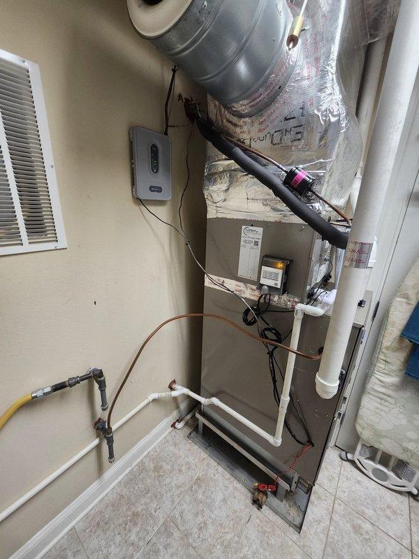 Successfully completed installation of a complete Carrier HVAC system, including a 59SC2E040M17 92% Gas Furnace with ECM Blower, 26SCA524A003 2-ton 15 SEER Air Conditioner, CVAVA2417 evaporator coil, LP Kit, and Honeywell zoning components with dual WiFi thermostats. Removed old equipment, installed metal duct transitions, replaced outdoor disconnect and electrical whip, and positioned outdoor unit on pressure-treated wood platform while reusing existing electrical, condensation, and power lines per specifications.