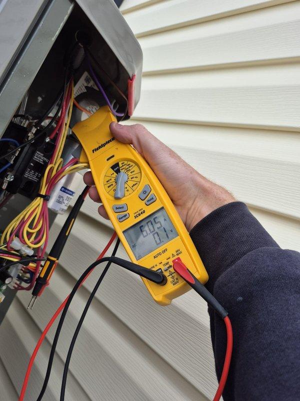 Performed scheduled heating maintenance service including electrical system diagnostics with Fieldpiece SC440 multimeter at exterior junction box. Inspected and verified proper electrical connections to heating system. Confirmed thermostat functionality with Sensi smart thermostat operating correctly in heat mode (66°F current/67°F set point) with 35% humidity reading.