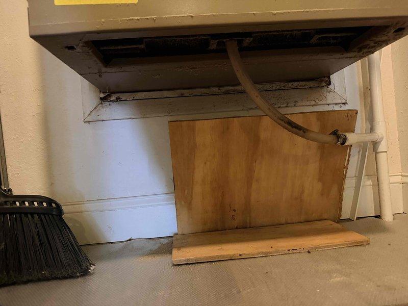 Conducted assessment of packaged HVAC unit in condo unit 2010 showing significant dust accumulation and discoloration. Inspection revealed deteriorated ventilation components including return air vent with clogged filter material. Recommended complete system replacement due to age-related wear and compromised efficiency.