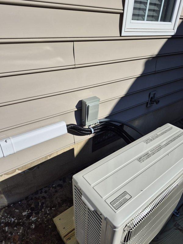 Successfully installed a Mitsubishi mini-split system with outdoor condenser unit mounted on a wooden platform. Completed all necessary electrical connections through junction box and ran refrigerant lines to the interior. System was properly staged prior to installation and thoroughly tested for optimal performance.