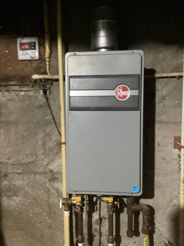Responded to service call for Rheem tankless water heater with reported leak and no hot water. Upon inspection, found issue with gas supply and water connections. Repaired faulty connection, verified proper operation of unit, and confirmed restoration of hot water service with no leaks present.