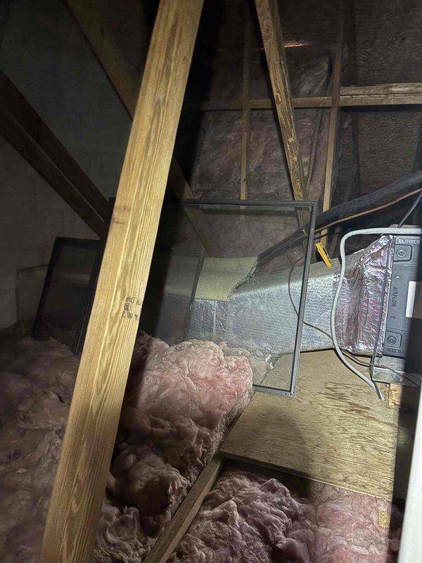 Conducted comprehensive heating system inspection in response to reported high electric bills in unoccupied residence. Examined attic HVAC components, ductwork connections, and structural supports. Identified insufficient insulation and potential thermal envelope issues contributing to system inefficiency and excessive energy consumption.