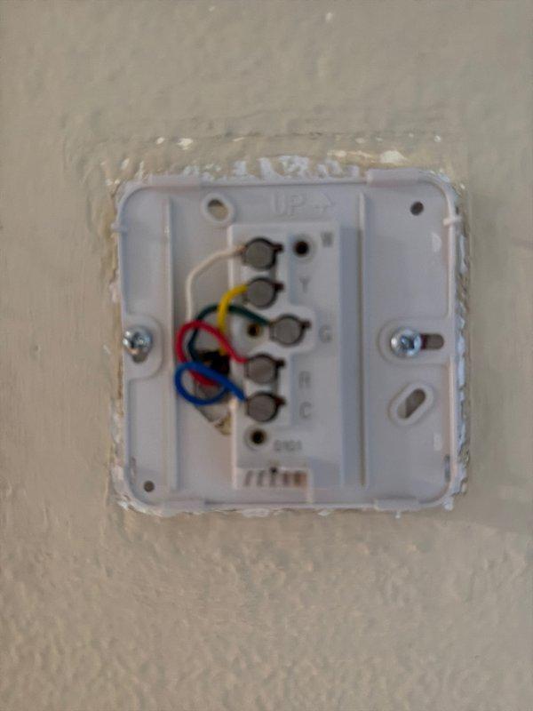 Performed assessment for potential system replacement of aging natural gas HVAC unit located in first floor storage closet. Unit is currently operational but at end of expected service life (original installation circa 2002). Documented existing Honeywell thermostat configuration and current wiring connections for replacement planning.
