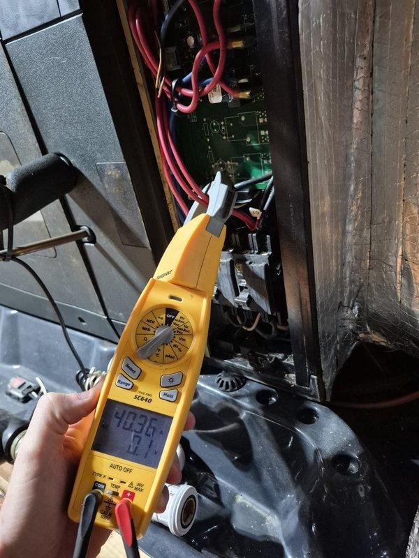 Performed scheduled heating system maintenance and conducted electrical diagnostics using SC640 multimeter on the control board. Tested voltage readings across multiple circuit points with readings of 403.4V noted on primary components. All electrical connections and safety circuits verified operational with no issues detected.