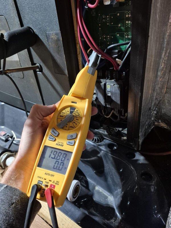 Performed scheduled heating system maintenance and conducted electrical diagnostics using SC640 multimeter on the control board. Tested voltage readings across multiple circuit points with readings of 403.4V noted on primary components. All electrical connections and safety circuits verified operational with no issues detected.
