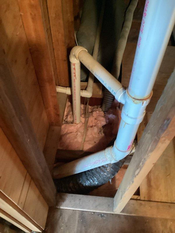 Conducted site survey for proposed bathroom addition, inspecting existing plumbing infrastructure. Evaluated PVC piping system within wall cavities, including primary vertical stack with T-junctions and elbows, and horizontal distribution lines. Documented current configuration of supply and drain lines to determine appropriate tie-in points for the new bathroom fixtures.