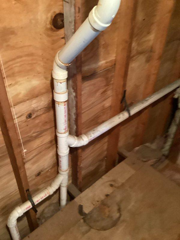 Conducted site survey for proposed bathroom addition, inspecting existing plumbing infrastructure. Evaluated PVC piping system within wall cavities, including primary vertical stack with T-junctions and elbows, and horizontal distribution lines. Documented current configuration of supply and drain lines to determine appropriate tie-in points for the new bathroom fixtures.