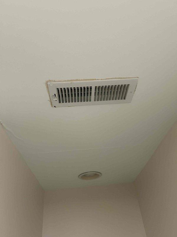 Responded to a service call for water leakage through bathroom ceiling from HVAC condensate line. Diagnosed issue with broken 2-inch drain pipe connection at 3-inch tee fitting. Determined repair requires installation of 2-inch to 3/4-inch PVC reducer, drilling into vent for threaded 3/4-inch fitting, and reconnecting furnace drain line to proper drainage path.