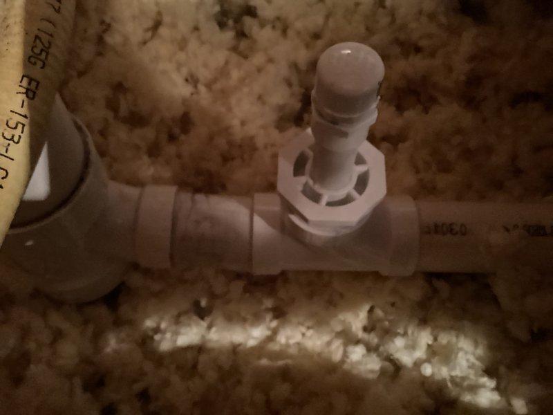 Successfully installed a 3x3x2 PVC tee fitting to connect the furnace drain line to the vent pipe, resolving an issue where the furnace and AC drain lines had frozen due to being improperly tied together. Utilized a 2"x3/4" PVC bushing and socket saver tool to complete the installation, preventing future freezing issues by ensuring proper drainage.