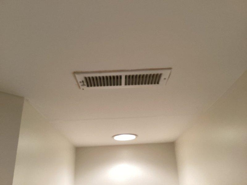 Successfully installed a 3x3x2 PVC tee fitting to connect the furnace drain line to the vent pipe, resolving an issue where the furnace and AC drain lines had frozen due to being improperly tied together. Utilized a 2"x3/4" PVC bushing and socket saver tool to complete the installation, preventing future freezing issues by ensuring proper drainage.