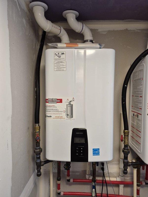 Performed scheduled maintenance service on Navien NPE-240A2(NG) tankless water heater (serial #1009047). Completed comprehensive system flush to remove mineral buildup and sediment, ensuring optimal heat transfer and efficiency. Unit is functioning properly with all connections secure and no leaks detected.