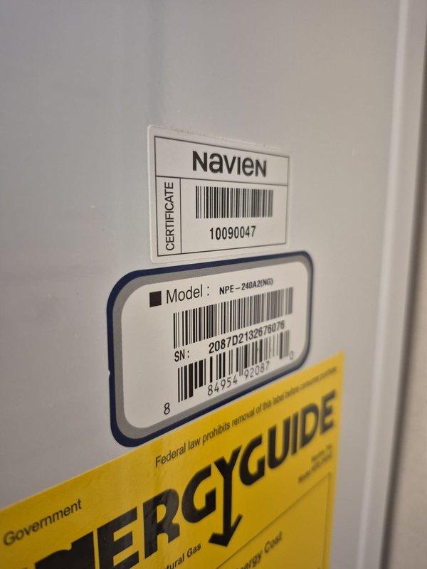 Performed scheduled maintenance service on Navien NPE-240A2(NG) tankless water heater (serial #1009047). Completed comprehensive system flush to remove mineral buildup and sediment, ensuring optimal heat transfer and efficiency. Unit is functioning properly with all connections secure and no leaks detected.