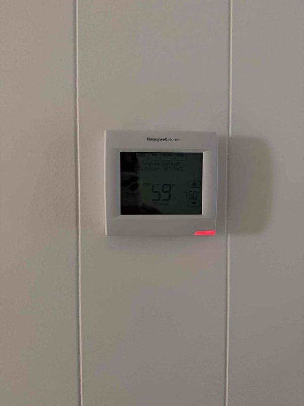 Conducted assessment of aging 19-year-old 3-ton American Standard HVAC system that was operating on emergency heat. System evaluation included inspection of thermostat functionality and air register configuration for potential replacement recommendation.