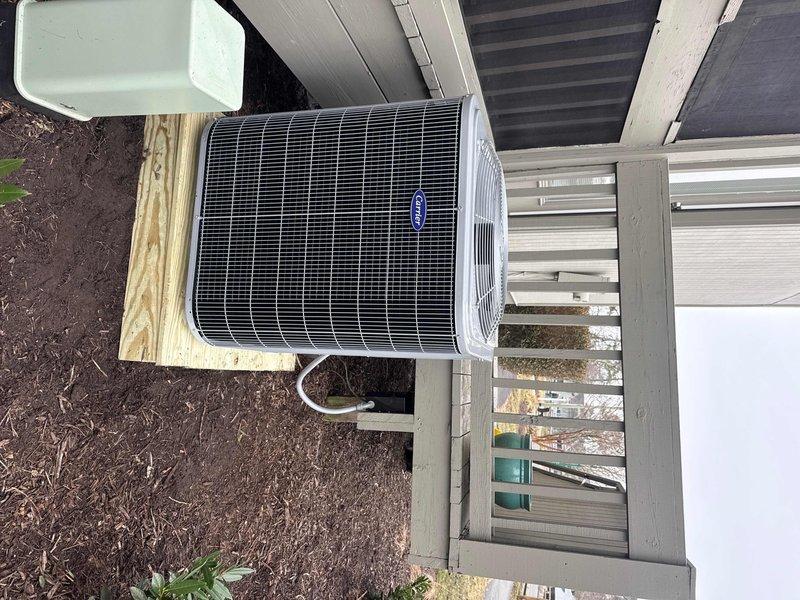 Successfully completed full HVAC system replacement, installing a Carrier 27SCA530A003 2.5-ton 15 SEER heat pump, Carrier FJ5ANXB30L00 air handler, and Carrier FF-2601C10 10kw electric heat pack with Honeywell Digital WiFi Thermostat. Installation included removing old equipment, adapting metal duct transitions to existing ductwork, replacing outdoor disconnect and electrical whip, and mounting the outdoor unit on a pressure-treated wood platform.