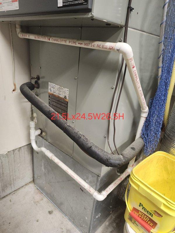 Diagnosed system failure on split HVAC system with no heat complaint. Inspection revealed condensate drain line blockage causing safety switch activation. Cleared obstruction, verified proper drainage through Charlotte PVC piping, and confirmed system operation restored with normal heating cycle.