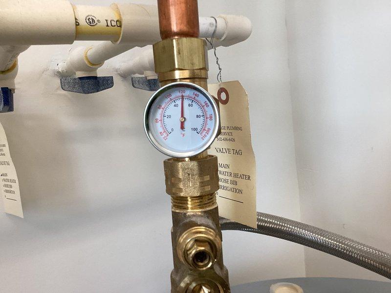 Responded to no hot water complaint on A.O. Smith ProLine water heater. Inspected system including pressure/temperature gauge, expansion tank, and valve assembly. Diagnosed and repaired issue, restoring hot water functionality with temperature now reading approximately 60-65 degrees.