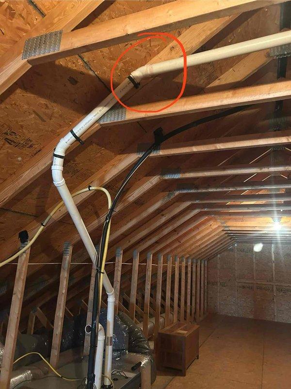 Responded to no heat complaint following power outage. Inspection revealed water damage in attic affecting PVC condensate drain connection, which had leaked onto OSB flooring. Repaired damaged pipe connection and verified system operation restored.