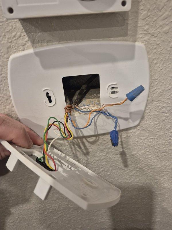 Installed new Honeywell HM750A1000 steam humidifier with Honeywell T10 WiFi thermostat for humidity control. Completed wiring connections for on-demand humidity regulation system, with customer arranging separate dedicated 20-amp power circuit installation by electrician.