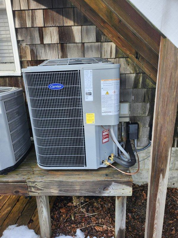Successfully completed a complete HVAC system replacement, installing a Carrier 27SCA530A003 2.5-ton 15 SEER Heat Pump with matching Carrier FJ5ANXB30 Air Handler and 10kW electric heat pack. Removed old equipment, adapted existing ductwork with metal transitions, replaced outdoor disconnect and electrical whip, and installed a Honeywell Digital WiFi thermostat for improved climate control.
