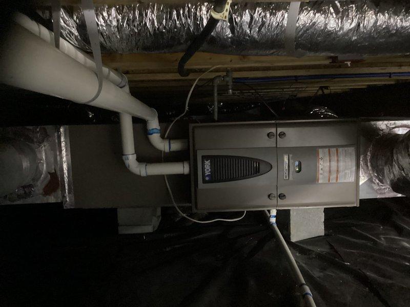 Performed comprehensive evaluation of 11-12 year old York hybrid system in crawlspace showing reduced efficiency. Inspection revealed significant buildup of dirt and debris within system housing and compromised ductwork connections. Recommended full system replacement to restore optimal heating and cooling performance and improve energy efficiency.