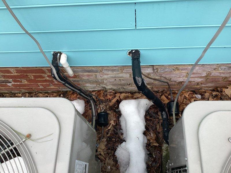 Responded to service call for multiple leak issues and water heater repairs. Addressed heavy corrosion at water heater connections and replaced waterlogged expansion tank. Fixed leaks in multiple locations including under master bathroom, second floor sink with slow drainage, loose toilet in half bath, and laundry sink. Noted HVAC system with missing filter in master bedroom closet and visible frost buildup on exterior refrigerant lines indicating potential cooling system issues.