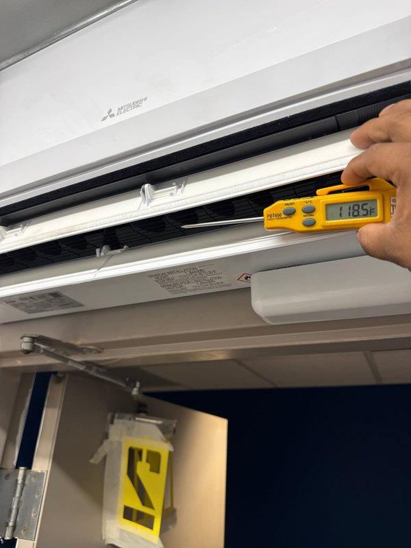 Successfully installed and tested a Mitsubishi Electric HVAC system including PUZ-AK12NL heat pump outdoor unit mounted on wall bracket and PKA-AL12NL fan coil unit with wireless remote. System installation included refrigeration and condensation lines concealed in metal top hat with fire caulking, automatic Gobi II condensation pump, and surge disconnect, with all components verified operational through temperature and pressure diagnostics.