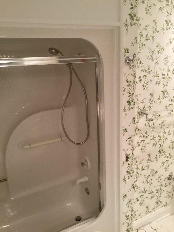 Completed installation of bathroom vanity with integrated sink and chrome fixtures, including proper plumbing connections and drain assembly. Also installed shower stall with fiberglass walls, handheld showerhead system, and grab bar for safety. Reset all plumbing in primary and guest bathrooms as requested, ensuring proper function and no leaks.