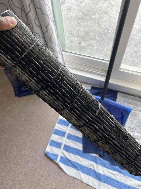 Replaced deteriorated corrugated condensate drain line on mini-split system that was causing water to discharge onto porch. Installed approximately 15 feet of new drain line and properly rerouted discharge into gutter to prevent future water damage. System will remain inactive until Spring as it is an A/C only unit.