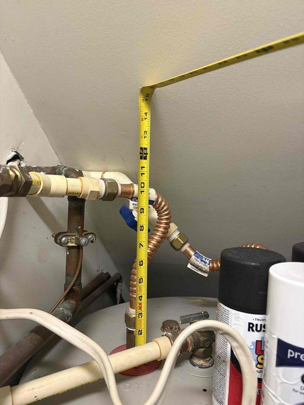 Performed routine maintenance on water heating system, inspecting Smith water heater and associated plumbing components. Checked all copper and PVC connections for leaks, verified proper installation of flexible copper lines, and confirmed operational status of valves and fittings. System is functioning correctly with no visible damage or leakage detected.