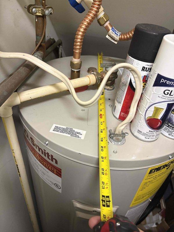 Performed routine maintenance on water heating system, inspecting Smith water heater and associated plumbing components. Checked all copper and PVC connections for leaks, verified proper installation of flexible copper lines, and confirmed operational status of valves and fittings. System is functioning correctly with no visible damage or leakage detected.