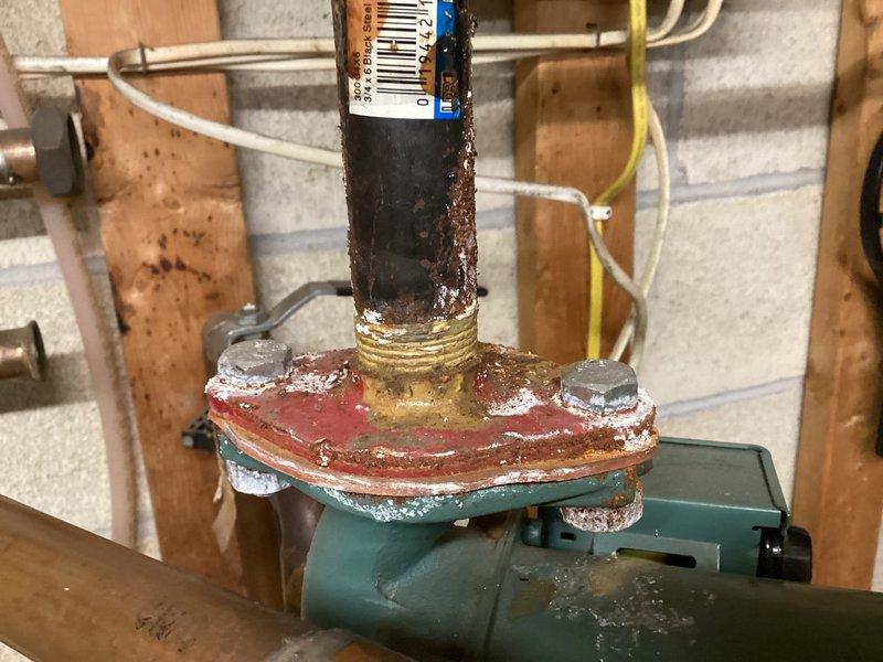 Installed new tankless water heater system to replace existing unit with significant corrosion and deterioration. Removed old circulator pump (Taco 0013-MSF1-IFC) which showed extensive rust damage at connection points and flanges. Installed new components and verified proper operation of the system after installation was complete.