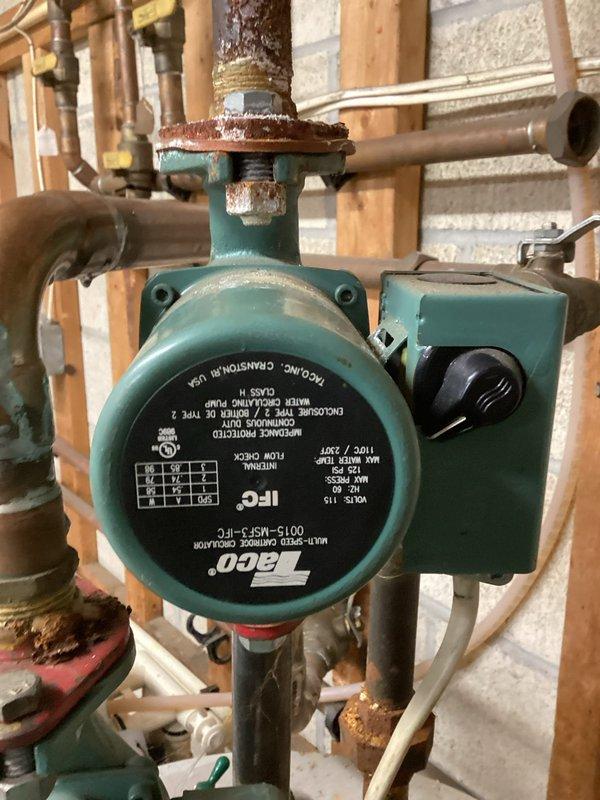 Installed new tankless water heater system to replace existing unit with significant corrosion and deterioration. Removed old circulator pump (Taco 0013-MSF1-IFC) which showed extensive rust damage at connection points and flanges. Installed new components and verified proper operation of the system after installation was complete.