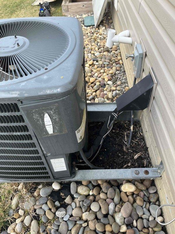 Responded to a no heat call for a furnace located in the crawl space. Diagnosed and repaired the heating system, returning it to proper operation. Exterior inspection of the property and HVAC equipment was conducted, including documentation of the outdoor condensing unit and associated drainage components.