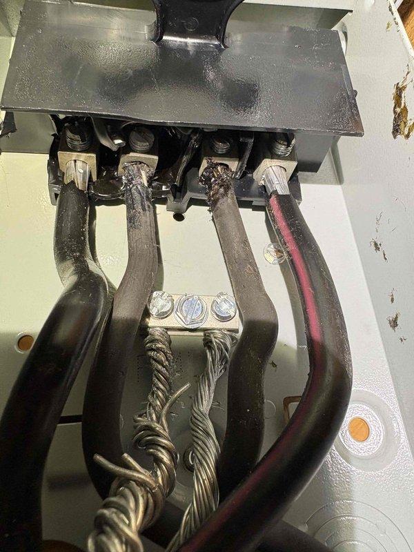 Diagnosed voltage supply issue to aging heating system, confirming 209V at power source. Inspected and repaired deteriorated electrical connections at junction box, including replacement of damaged wiring and terminal connections to restore proper system operation.
