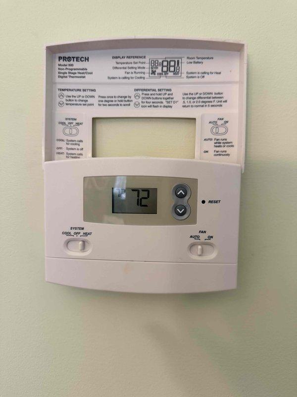 Conducted assessment of two HVAC systems requiring replacement. Original Rheem unit (model RAPC-036JAZ) installed in 2005 showing age-related wear. Systems serve separate zones (1st/2nd floors and 3rd/4th floors) with controlled damper systems and individual thermostats per floor. Current PROTECH Model 500 digital thermostat maintains functionality but would be upgraded with system replacement.