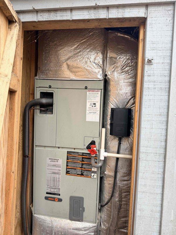 Conducted estimate for full HVAC system and ductwork replacement. Existing system includes an aging indoor furnace/air handler installed in utility closet with deteriorating insulation and an outdoor condenser unit showing significant weathering mounted on a wooden platform affected by moisture damage. Photos documented current installation configuration for proper replacement planning.