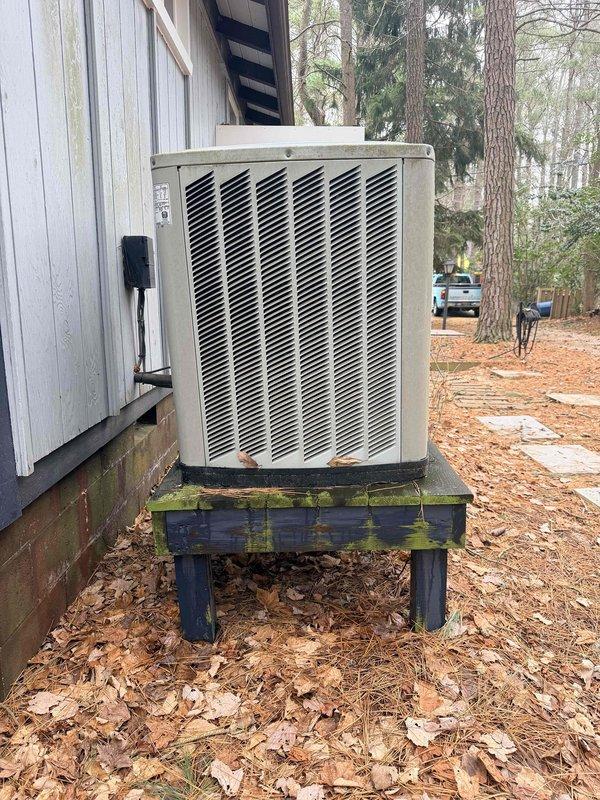 Conducted estimate for full HVAC system and ductwork replacement. Existing system includes an aging indoor furnace/air handler installed in utility closet with deteriorating insulation and an outdoor condenser unit showing significant weathering mounted on a wooden platform affected by moisture damage. Photos documented current installation configuration for proper replacement planning.