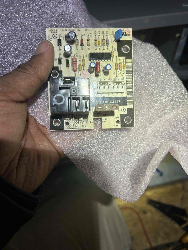 Responded to emergency call for a heating system that continuously ran and wouldn't shut off when reaching set temperature, automatically switching to emergency heat mode. Diagnostic testing with multimeter identified faulty circuit board with defective fan relay. Replaced control module/relay board (part #A0063717) to restore proper thermostat communication and heating cycle operation.