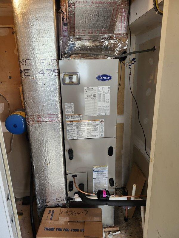 Successfully completed a comprehensive dual-system HVAC installation, replacing existing equipment with new Carrier heat pump systems. Downstairs installation included a 3-ton 15 SEER heat pump (model 27SCA536A003) with fan coil unit and 10kW electric heat kit, while upstairs received a 1.5-ton 15 SEER heat pump (model 27SCA518A003) with matching air handler and 10kW electric heat pack. Adapted metal duct transitions as needed, replaced outdoor disconnect and electrical whip, and positioned outdoor units on existing stand while reusing appropriate electrical, condensation and power lines.