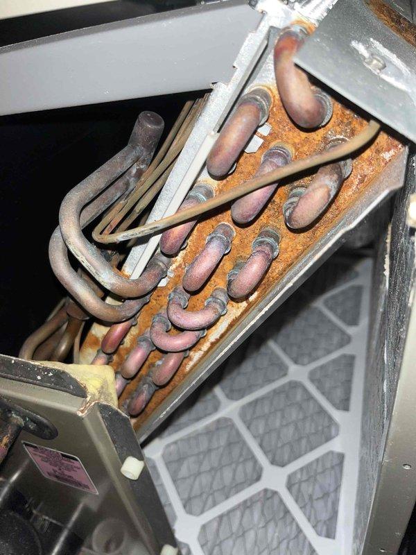 Performed cooling system inspection on two systems. Both units showed significant copper coil deterioration with extensive corrosion, oxidation, and rust formation throughout the heat exchanger components. Documented condition with detailed photos for future reference and maintenance planning.