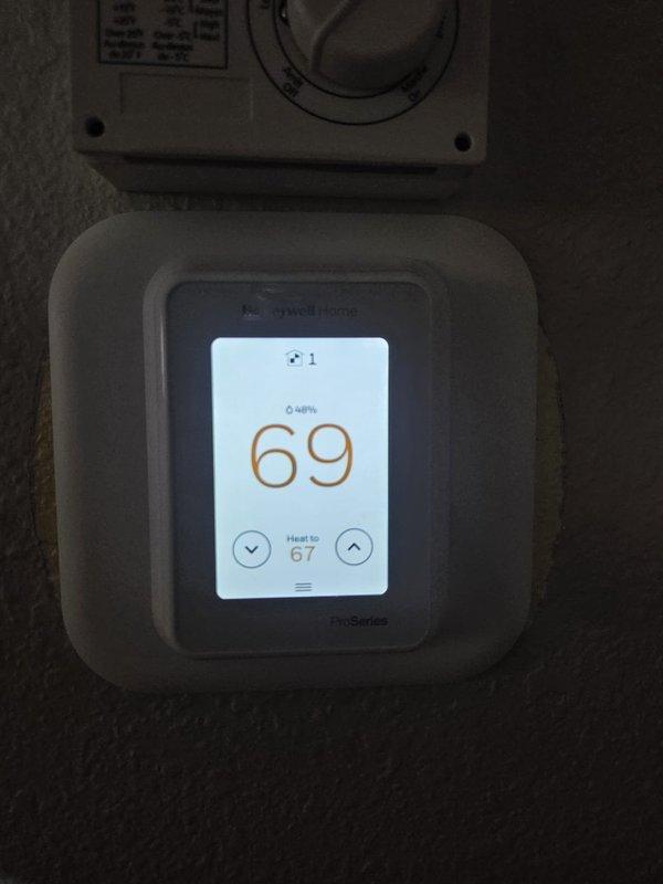 Completed routine cooling maintenance service on HVAC system. Performed diagnostic testing with UEi digital tool showing 444 measurement reading. Verified Honeywell T-Series thermostat operation with current temp at 69° and heat set to 67°, confirming proper system functionality.