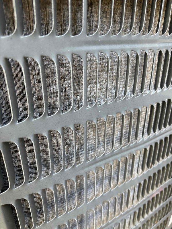 Conducted comprehensive heating and cooling system inspection. Found significant dust accumulation on cooling fins requiring thorough cleaning. Inspected underfloor ductwork connections and insulation, noting proper installation of PVC pipe connections to insulated flexible ducting in crawlspace area.