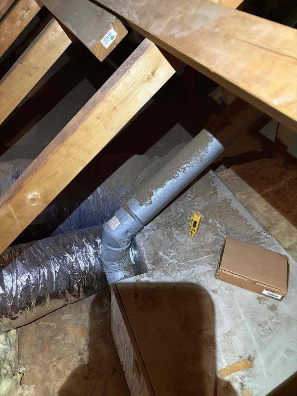 Conducted comprehensive heating and cooling system inspection. Found significant dust accumulation on cooling fins requiring thorough cleaning. Inspected underfloor ductwork connections and insulation, noting proper installation of PVC pipe connections to insulated flexible ducting in crawlspace area.