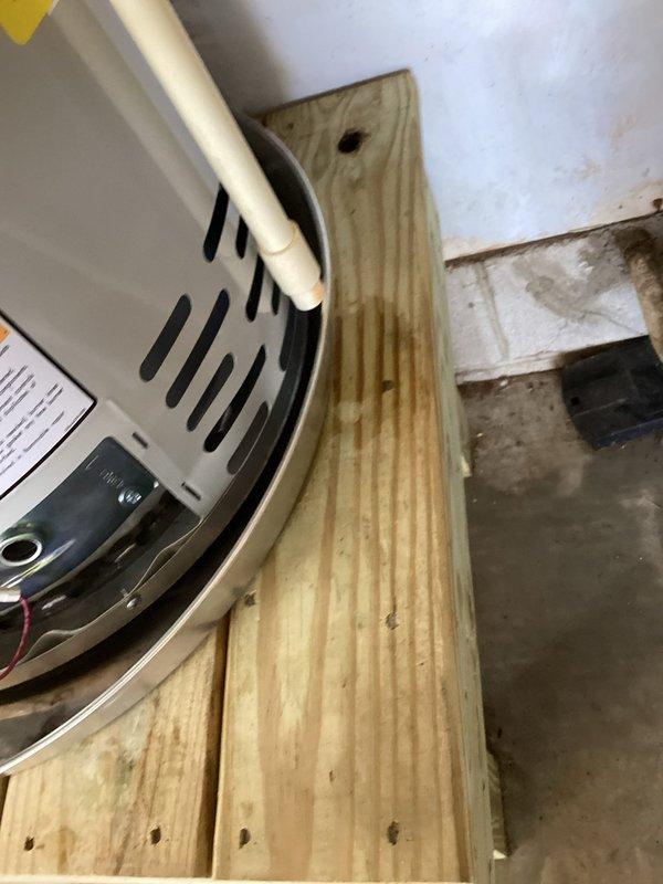 Responded to emergency water leak from recently installed water heater. Discovered water pooling on garage floor from the Icon System unit mounted on wooden platform. Inspected control panel, connections, and temperature settings; resolved leak by properly securing fittings and ensuring proper operation of the backflow prevention system.