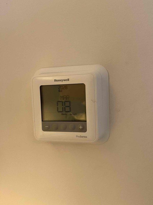 Responded to no cooling complaint where tenant had replaced batteries in Honeywell ProSeries thermostat but system would not operate afterward. Diagnosed configuration issue in thermostat settings and reprogrammed device to properly communicate with HVAC system. Verified proper operation of both heating and cooling modes before departure.