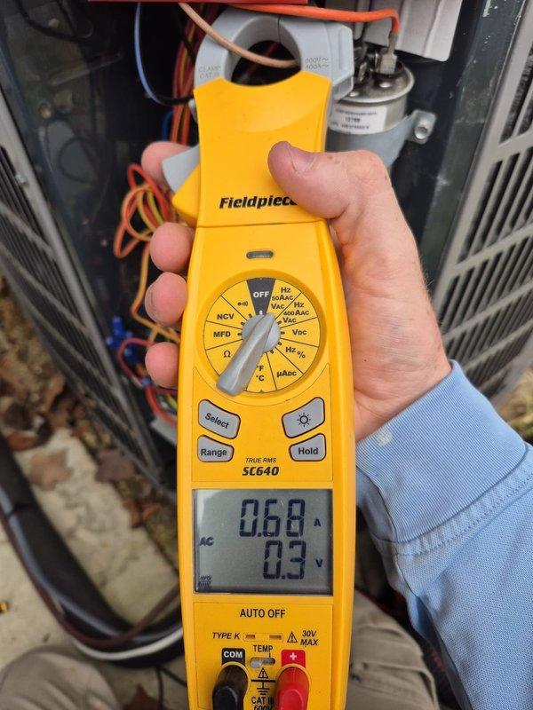 Performed scheduled cooling maintenance visit on system. Conducted electrical testing using Fieldpiece SC640 clamp meter, measuring amperage readings of 0.72A and 0.68A with voltage at 0.3V. Inspected capacitor and verified all electrical components and connections were functioning within normal parameters.