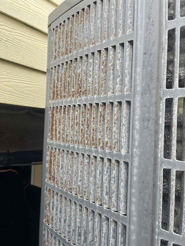 Performed routine cooling maintenance on four HVAC systems including Mitsubishi and Fujitsu units. Found significant debris accumulation in exterior condenser grille causing restricted airflow. Accessed indoor equipment via ladder to service ceiling-mounted components and cleaned obstructed surfaces to restore proper system operation.