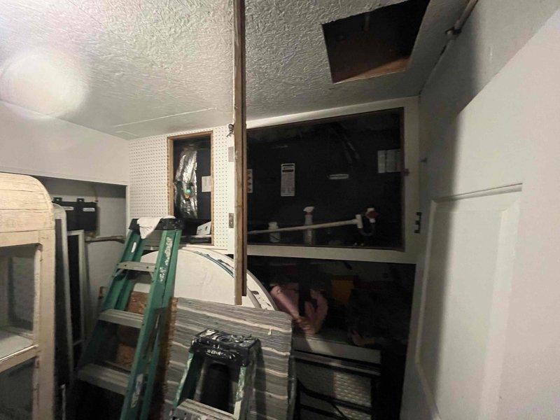 Performed routine cooling maintenance on four HVAC systems including Mitsubishi and Fujitsu units. Found significant debris accumulation in exterior condenser grille causing restricted airflow. Accessed indoor equipment via ladder to service ceiling-mounted components and cleaned obstructed surfaces to restore proper system operation.